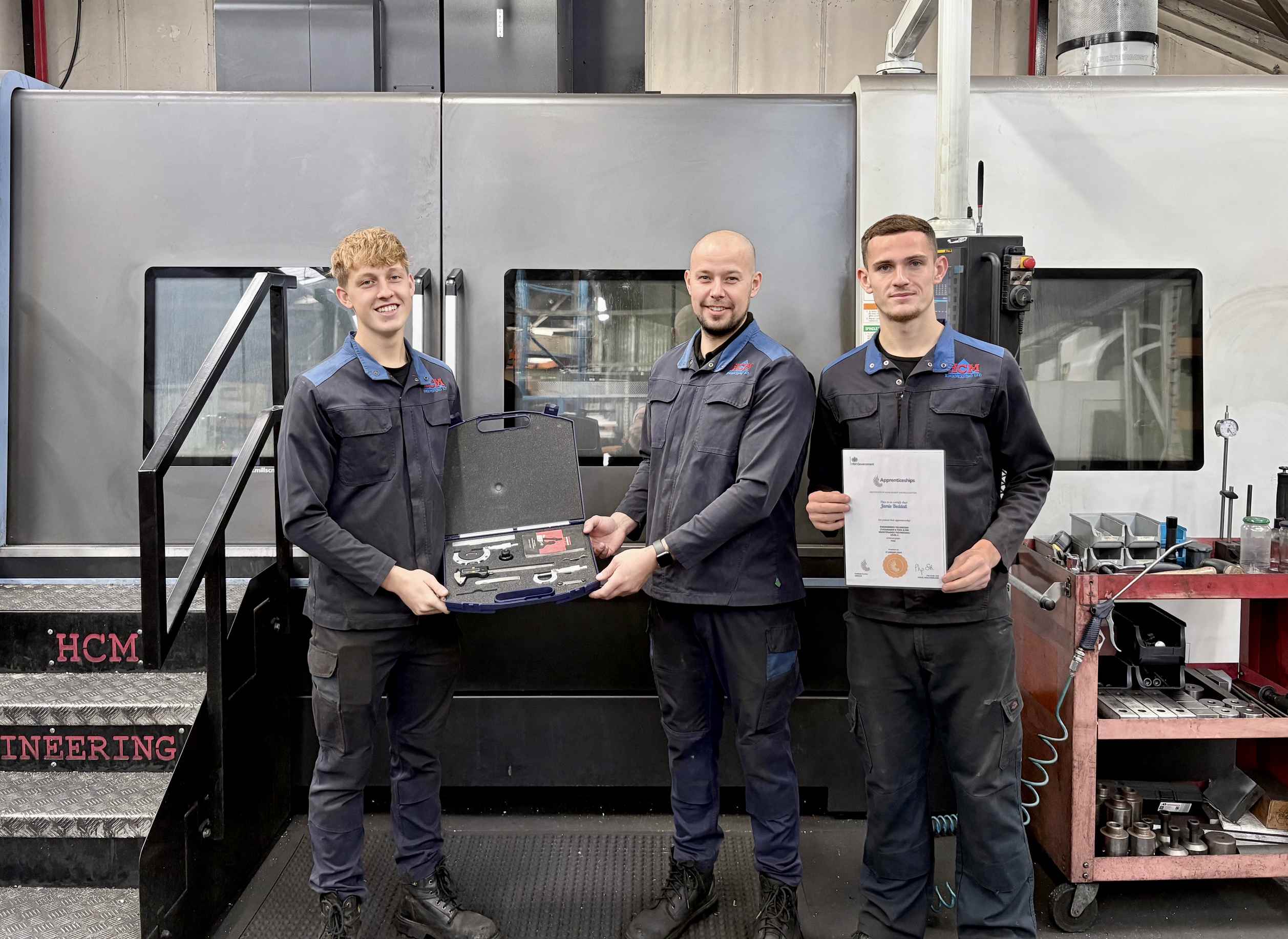 HCM_New_web Left to right - Dan Payne (13 yrs service) & mentor to Jack Gleadow (2yrs service), centre – gifting his 2nd year completion kit, alongside on right Jamie Beddall (5yrs service) – with his apprenticeship completion certificate